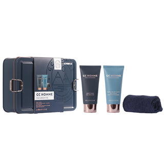 A gift set containing two tubes of grooming products and a reusable pouch, packaged in a metal tin with 'GC HOMME' branding.