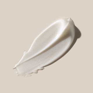 White cream swatch on a beige background