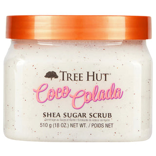 Tree Hut Coco-Colada Shea Sugar Scrub in a clear plastic jar with a metallic copper lid, showing the white cream scrub inside with visible brown sugar specks.