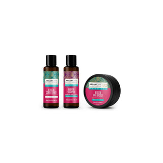 A hair care set from Aargani Haircare featuring two amber bottles of Keratin Conditioner and Keratin Shampoo with black caps, and a black jar of Keratin Hair Mask, arranged on a plain white background.