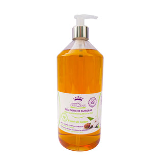 A bottle of Freylin's Flavour de Colón Shower Gel, filled with amber-colored liquid, featuring a white pump dispenser and a white label with purple and green text.