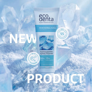 Ecodenta remineralising toothpaste tube with ice cubes and 'NEW PRODUCT' text on a blue background