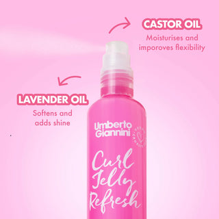 A pink bottle of Umberto Giannini Curl Jelly Refresh hair product centered on a pink background, with callout text reading Lavender Oil and Castor Oil and descriptive copy.