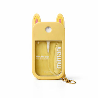 Yellow case with cat ears containing a hair and body wash bottle, on a white background