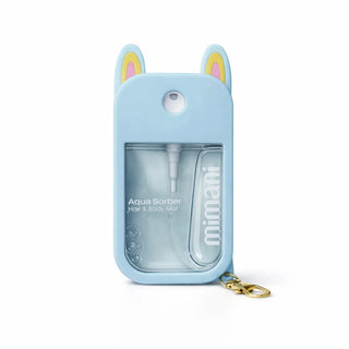 A light blue silicone case for a Mimani Aqua Sorbier hair and body mist, featuring bunny ears with yellow and pink accents, a clear front window showing the bottle, and a gold keychain ring.