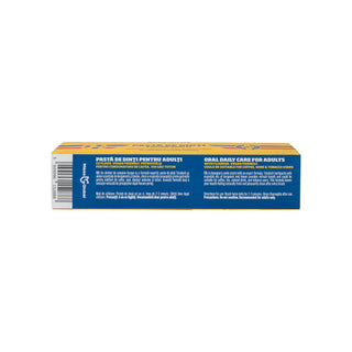 A rectangular yellow box of Tricolor brand adult toothpaste