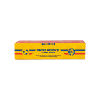 A rectangular yellow box of Tricolor brand adult toothpaste, featuring blue and red stripes and Romanian text, centered on a plain white background.