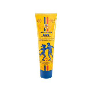 A yellow squeeze tube of Tricotool Kids toothpaste with a blue cap, featuring blue silhouettes of children and red, yellow, and blue stripes on the front, set against a plain white background.