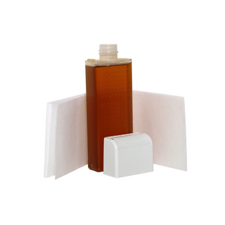 A clear plastic bottle filled with amber liquid, shown with two white filter pads and a white cap on a plain white background.