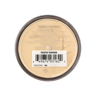 Top-down view of a round makeup compact lid showing the brand name Ruby Kisses and shade name RSPO02 Banana, with a barcode label over a beige pressed powder surface.