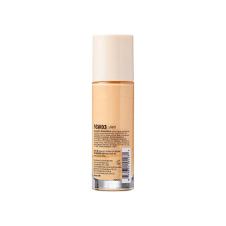 Cosmetic bottle with beige liquid on a white background