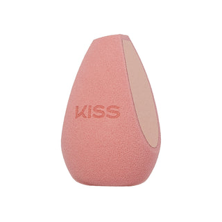 A teardrop-shaped makeup sponge in a dusty pink color, featuring the brand name 'KISS' embossed on the front and a smooth beige inner side, set against a plain white background.