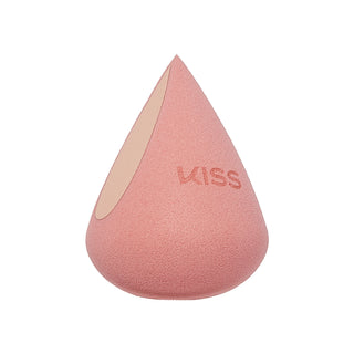 A teardrop-shaped makeup sponge in a dusty pink color with a lighter beige interior side and the brand name 'KISS' embossed on the front, set against a plain white background.