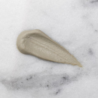 Beige cream smear on a marble background