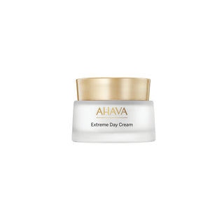 A white cosmetic jar of AHAVA Extreme Day Cream with a metallic gold lid, centered on a plain white background.