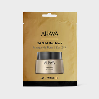 AHAVA 24 Gold Mud Mask in its gold foil packaging, featuring a depiction of the black and gold jar on the front, set against a light gray background.