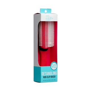 A red detangling hairbrush in its retail packaging, featuring a white and light blue box with the brand name 'Missed Colors of Care' and product text 'Detangling Non-Slip Brush'.