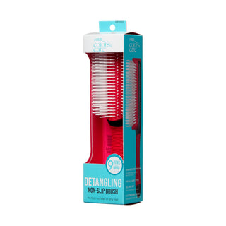 Detangling brush with packaging on a white background
