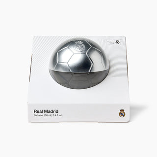 Real Madrid perfume bottle in its original white packaging box, featuring a soccer ball design with a metallic silver top half and a dark gray bottom half.