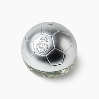 A Real Madrid soccer ball shaped perfume bottle with a metallic silver cap and a clear glass base, shown on a light gray background.