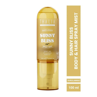 Thalia Sunny Bliss UV+ Hair & Body Spray Mist in a translucent amber bottle, shown next to a vertical gold label with product details.