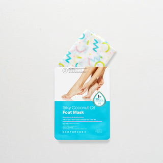 Madforcos Silky Coconut Oil Foot Mask sheet packaging with a peek of the patterned mask sheet, shown on a clean white background.
