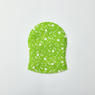 A green fabric pouch with a white pattern of crescent moons, stars, and abstract shapes, shown on a plain light gray background.