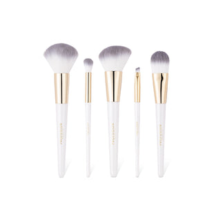 A five-piece makeup brush set with white handles, gold ferrules, and soft lavender-gray bristles, arranged vertically on a clean white background.