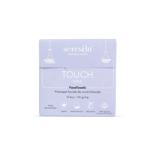 A square product box for SereSkin Touch Mini FaceTowels, featuring a light lavender purple color with white text and minimalist line drawings of hanging lamps and a towel, set against a plain white background.