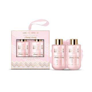 Luxury Bathing Sweet Scents & Yang Yang set, featuring a pink gift box with two bottles inside and two matching pink bottles with gold caps displayed in front on a white background.