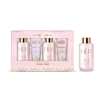 Yang's Long Luxury Bathing Set featuring a pink gift box with four bottles inside and one matching bottle displayed beside it on a white background.